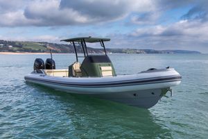 Cobra Ribs Twisted T700R 2024 Cobra Ribs Twisted T700R boat on calm water, scenic coastal background.