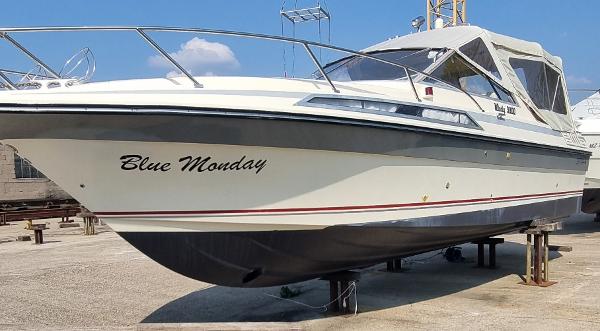 Windy 9800 1988 Windy 9800 boat named "Blue Monday" on dry dock, showcasing sleek design.