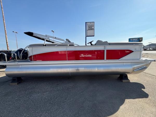 Barletta Cabrio 22QC 2025 Barletta Cabrio 22QC pontoon boat with red and silver design, displayed outdoors.