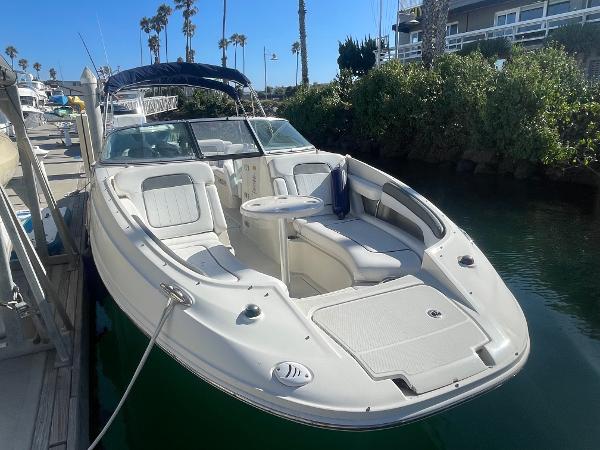 Sea Ray 260 Sundeck 2010 Sea Ray 260 Sundeck boat docked in sunny marina.