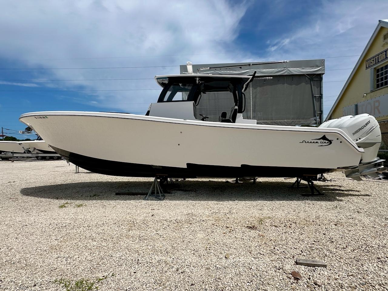 Streamline 35CC 2021 Streamline 35CC boat on display, white hull, outdoor setting, clear sky background.
