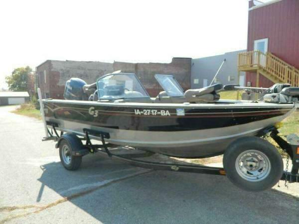 G3 Angler V185 FS 2006 G3 Angler V185 FS boat on trailer, parked outdoors.