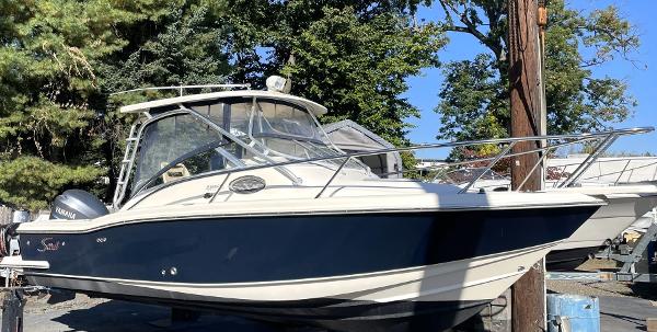 Scout 242 Abaco 2006 Scout 242 Abaco boat with Yamaha engine, docked outdoors.