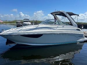 Regal 28 Express 2022 Regal 28 Express boat docked on a sunny day with clear skies.