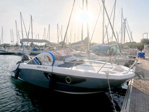 Idea 70.2 Modern Idea 70.2 boat docked at marina, sunlight reflecting on water, 2022 model.