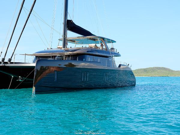 Sunreef 80 Eco 2024 Sunreef 80 Eco yacht on turquoise water, showcasing sleek design and luxury features.