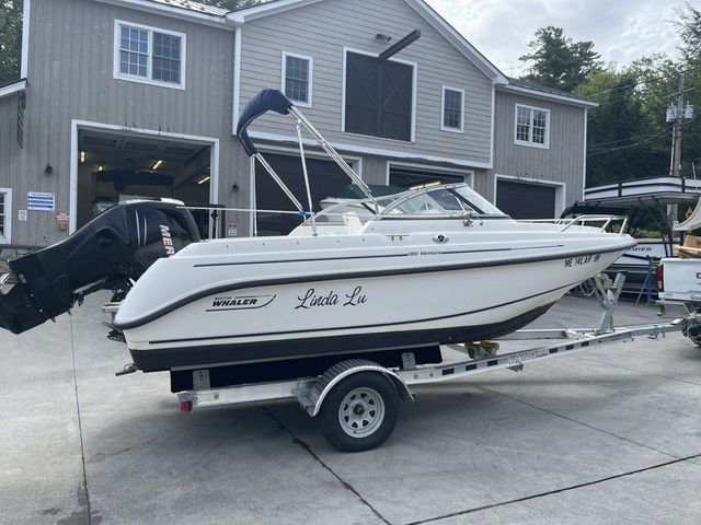 Boston Whaler 180 Ventura 2006 Boston Whaler 180 Ventura boat on trailer in front of a garage.