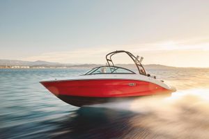 Sea Ray SPX 210 2026 Sea Ray SPX 210 speedboat cruising on open water at sunset.