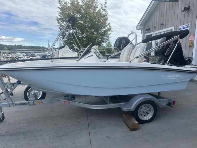 Boston Whaler 130 Super Sport 2025 Boston Whaler 130 Super Sport boat on trailer, parked outdoors.