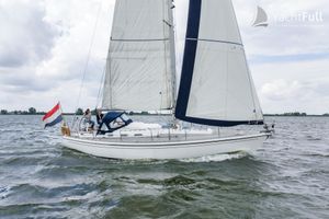 Victoire 1122 Sailing yacht Victoire 1122 (2003) on open water with Dutch flag, cloudy sky.