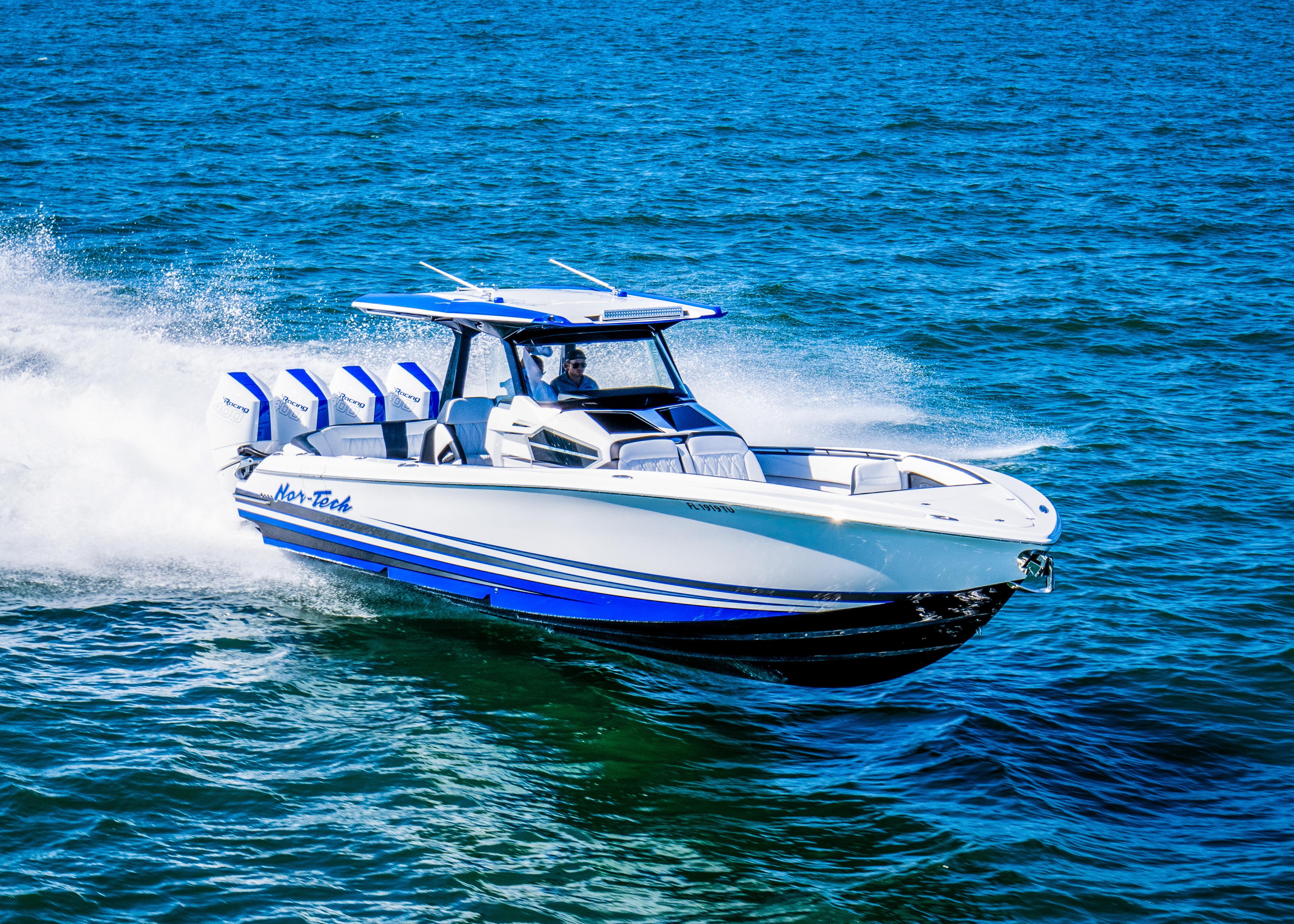 Nor-Tech 400 Supersport 2024 Nor-Tech 400 Supersport boat speeding on open water, showcasing sleek design and powerful engines.