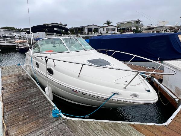 Sea Ray 240 Sundancer 2007 Sea Ray 240 Sundancer boat docked at marina, featuring sleek white design.