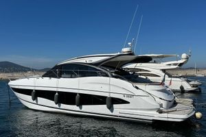 Princess V50 2024 Princess V50 yacht docked in a marina under clear blue skies.