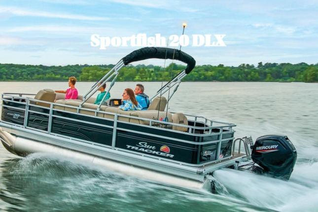 Sun Tracker Sportfish™ 20 DLX 2026 Sun Tracker Sportfish™ 20 DLX pontoon boat cruising on a lake with passengers.