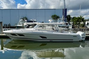 Intrepid 409 Valor 2022 Intrepid 409 Valor boat docked at marina under cloudy sky.