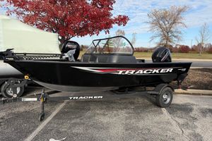 Tracker Pro Guide V-16 WT 2026 Tracker Pro Guide V-16 WT boat on trailer, parked near autumn trees.