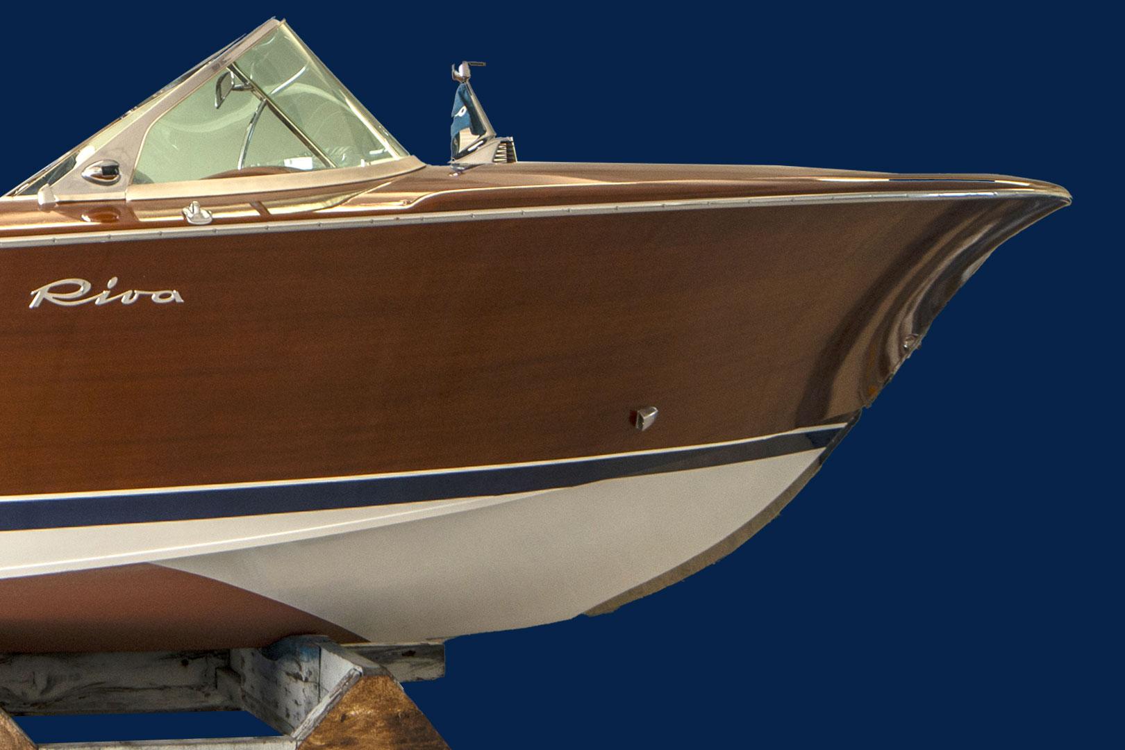 Riva Olympic 1969 Riva Olympic boat with sleek wooden design on display.