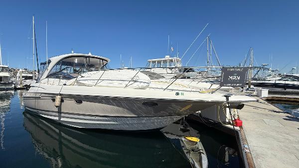 Regal Commodore 4260 2003 Regal Commodore 4260 yacht docked at marina, clear blue sky, for sale sign visible.