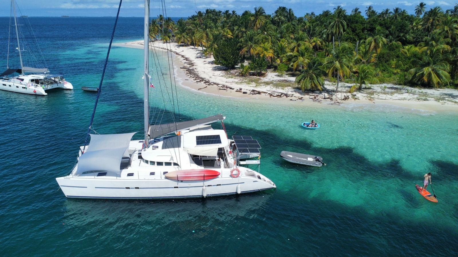 Lagoon 570 Lagoon 570 catamaran anchored near tropical island with clear turquoise waters, 2004 model.