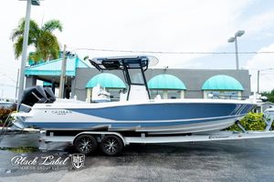Caymas 281 HB 2025 Caymas 281 HB boat on trailer, displayed outdoors at Black Label Marine Group.