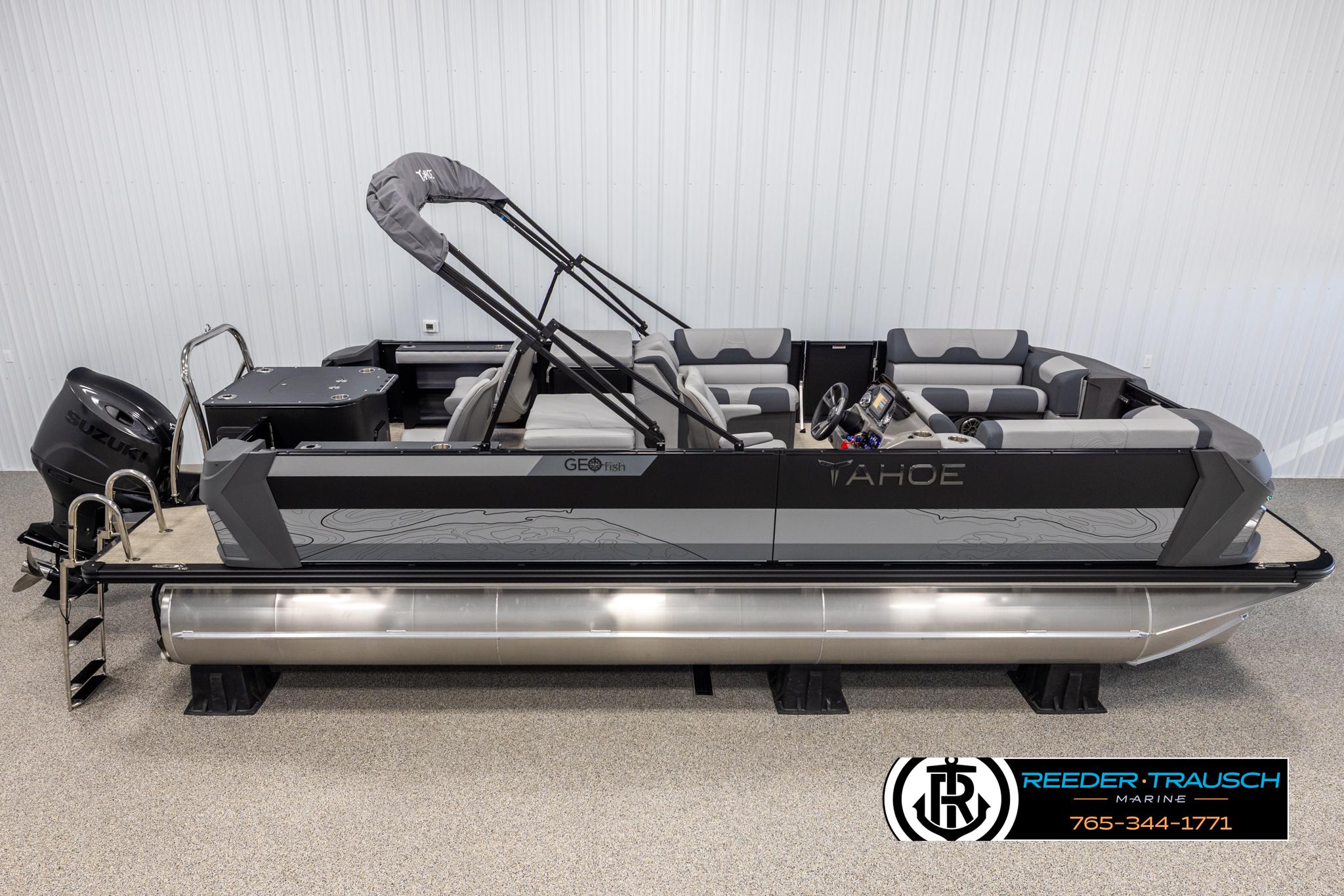 Tahoe TGO RF 2025 Tahoe TGO RF pontoon boat with Suzuki engine, displayed indoors.