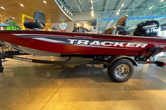 Tracker Pro Team 175 Crappie Edition 2025 Tracker Pro Team 175 Crappie Edition boat displayed indoors, red with Mercury engine.