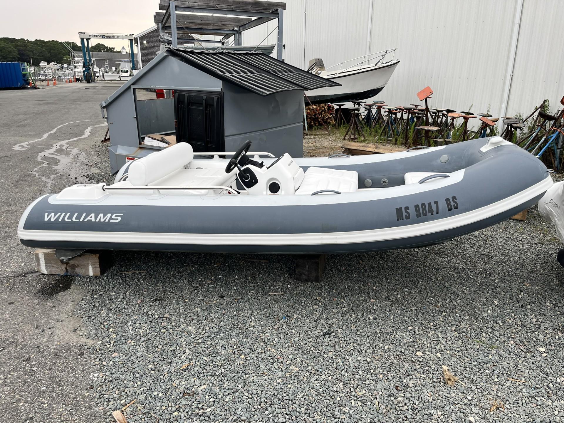 Williams Jet Tenders Sportjet 395 2022 Williams Jet Tenders Sportjet 395, gray and white, parked on gravel.