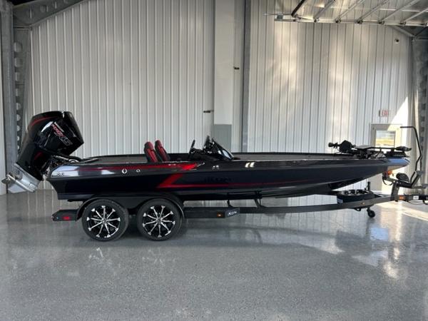 iKon LX21 2024 iKon LX21 black and red fishing boat in a showroom.