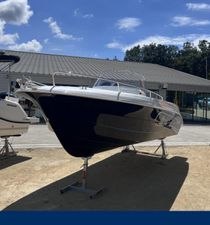 Pacific Craft 625 Open Trendy 2023 Pacific Craft 625 Open Trendy boat displayed outdoors under a clear blue sky.