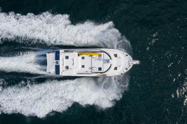 Ranger Tugs R-43 S Aerial view of 2025 Ranger Tugs R-43 S yacht cruising on open water.
