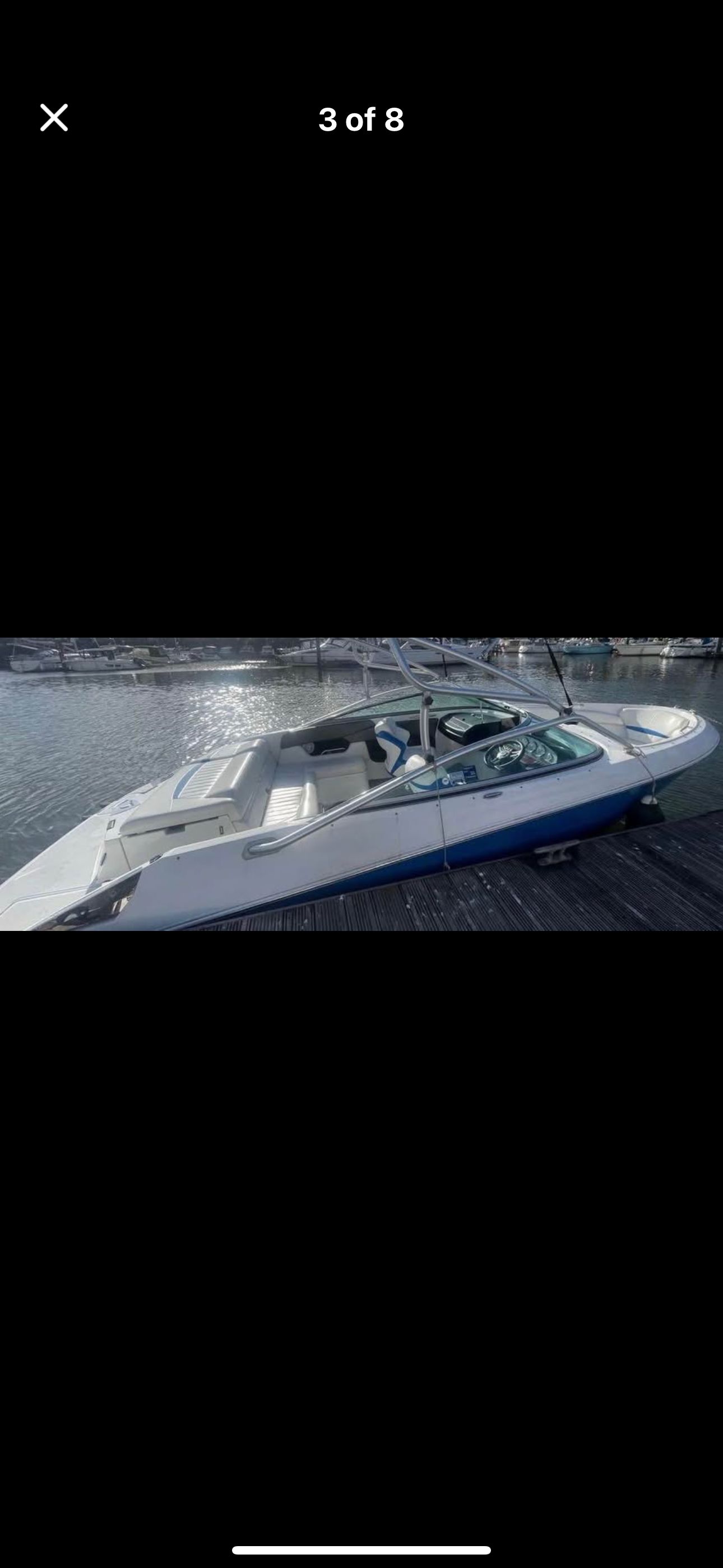 Regal 2200 Bowrider 2012 Regal 2200 Bowrider boat docked on a sunny day.