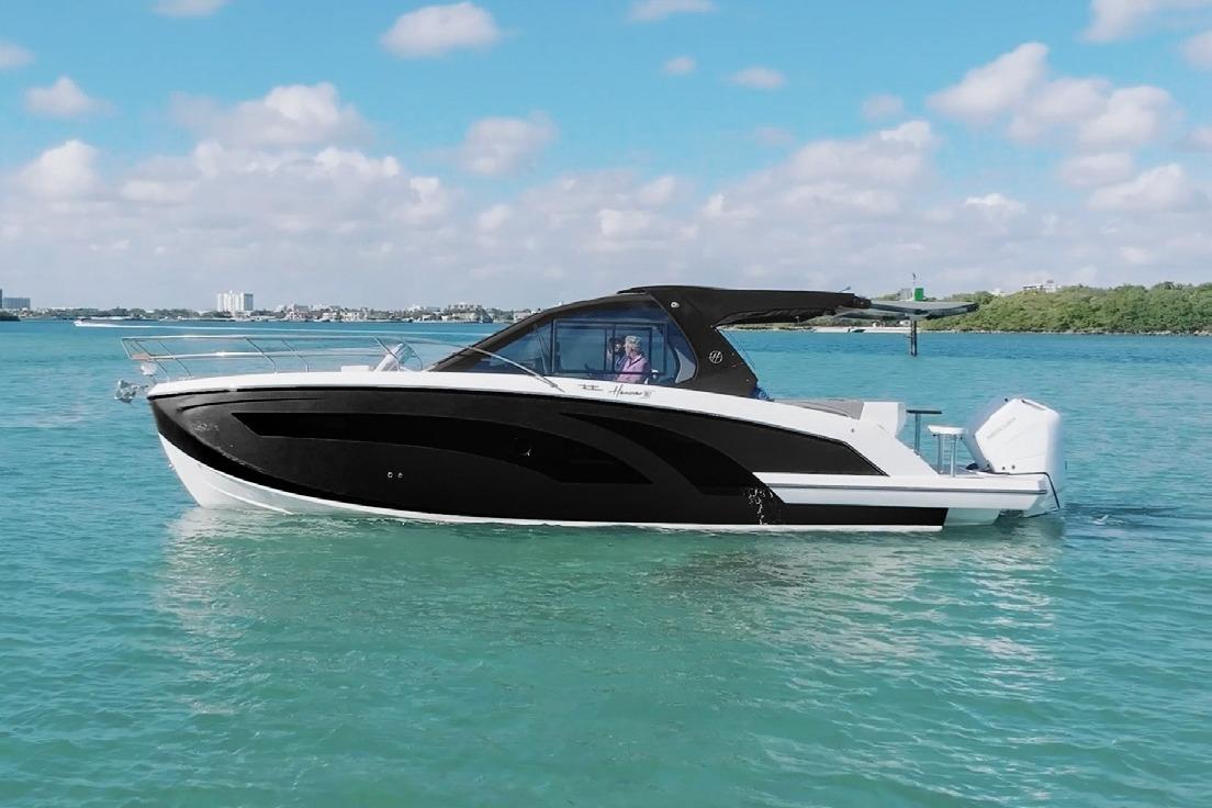 Hanover 387 Tuxedo Luxury Edition 2026 Hanover 387 Tuxedo Luxury Edition boat cruising on clear blue water.