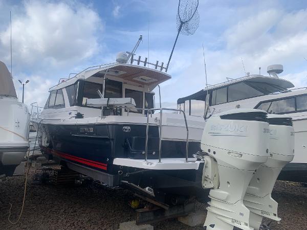 Cutwater C 302 Coupe 2018 Cutwater C 302 Coupe boat on dry dock with twin Suzuki outboard engines.