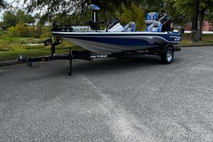 Nitro Z18 Pro 2025 Nitro Z18 Pro fishing boat on trailer, parked outdoors.