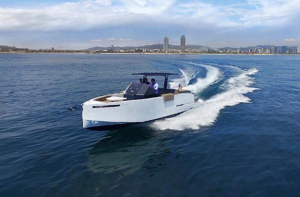 De Antonio Yachts D28 Open 2024 De Antonio Yachts D28 Open cruising on open water with city skyline in background.