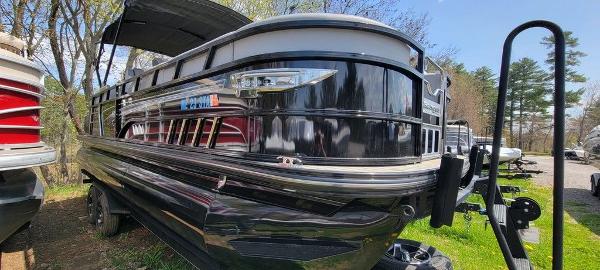 Ranger 2300LS 2020 Ranger 2300LS pontoon boat in black, parked on grass.