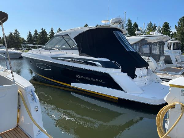 Regal 42 Sport Coupe 2015 Regal 42 Sport Coupe yacht docked in a marina.