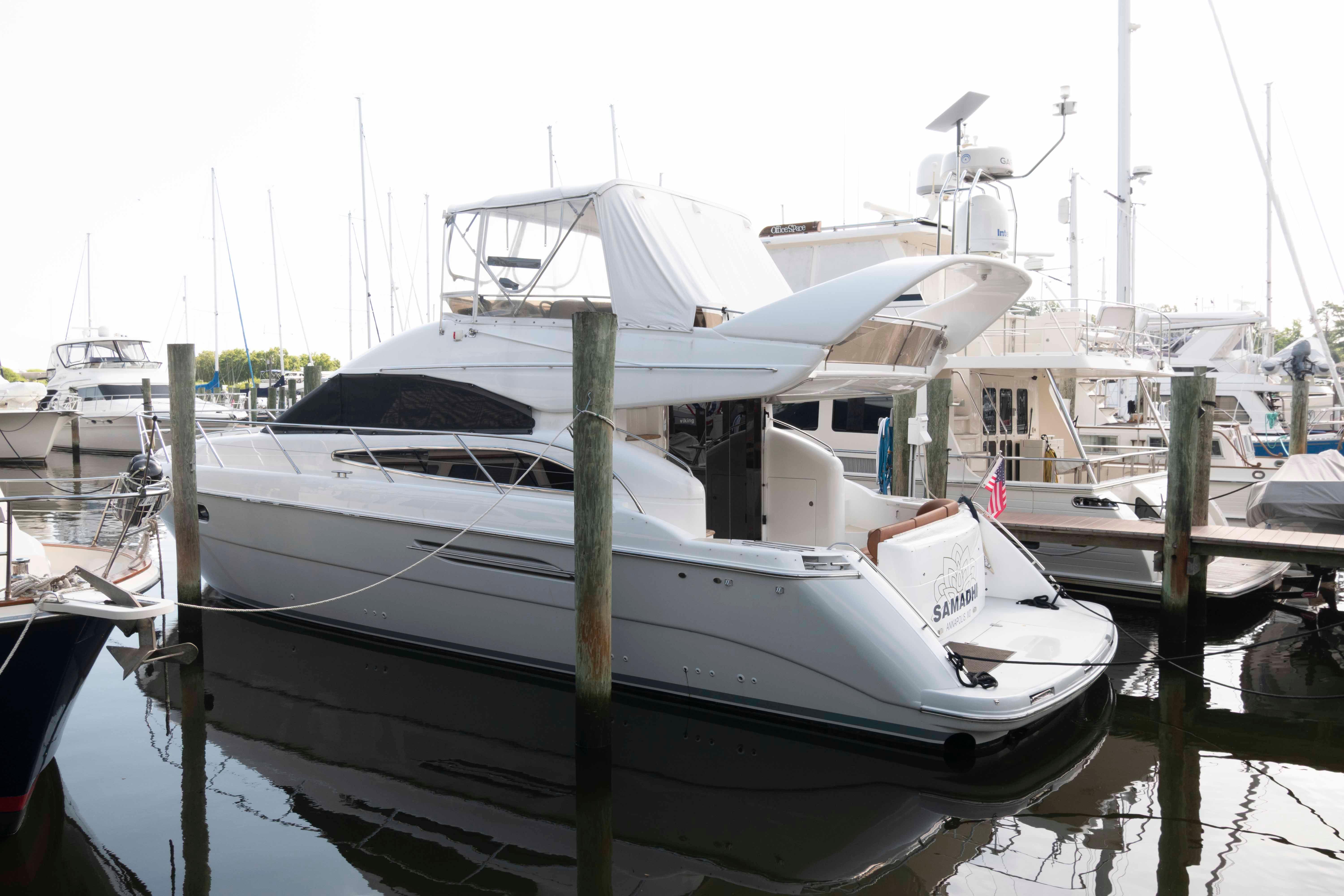 Princess 50 2003 Princess 50 yacht docked at marina, featuring sleek design and spacious deck.