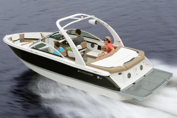 Four Winns H230 Manufacturer Provided Image: 2016 Four Winns H230 boat cruising on water with passengers.