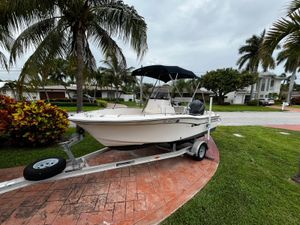 Grady-White Fisherman 180 2013 Grady-White Fisherman 180 boat on trailer, parked near palm trees.