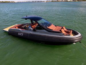SACS Rebel 40 2019 SACS Rebel 40 boat on water, sleek design, luxury seating, sunny day.