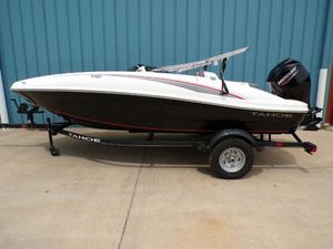 Tahoe T16 2024 Tahoe T16 boat on trailer, black and white design, parked by blue wall.