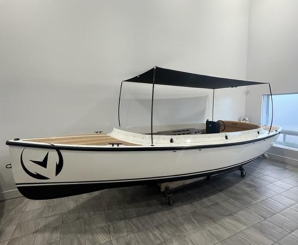 Vision Marine Technologies Fantail 217 2024 Vision Marine Technologies Fantail 217 boat with canopy, displayed indoors.