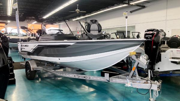 Crestliner 1850 Fish Hawk WT JS 2025 Crestliner 1850 Fish Hawk WT JS boat displayed in showroom on trailer.