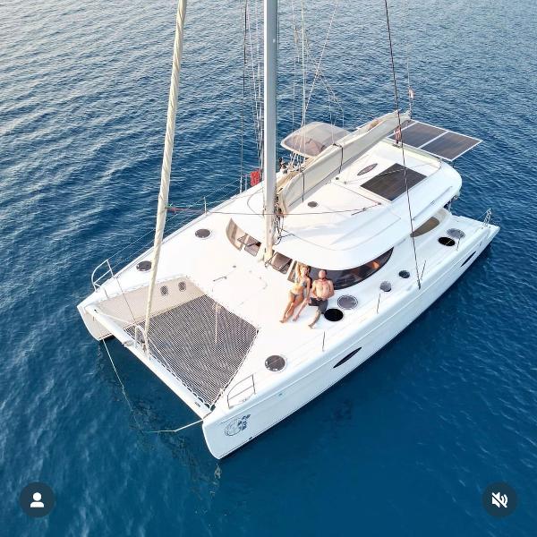 Fountaine Pajot Lipari 41 Aerial view of 2011 Fountaine Pajot Lipari 41 catamaran on blue ocean water.