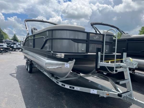 Barletta Cabrio Ultra Lounge C24UC 2024 Barletta Cabrio Ultra Lounge C24UC pontoon boat on a trailer under a cloudy sky.