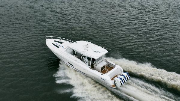 Intrepid 409 Valor 2022 Intrepid 409 Valor boat cruising on open water, aerial view.
