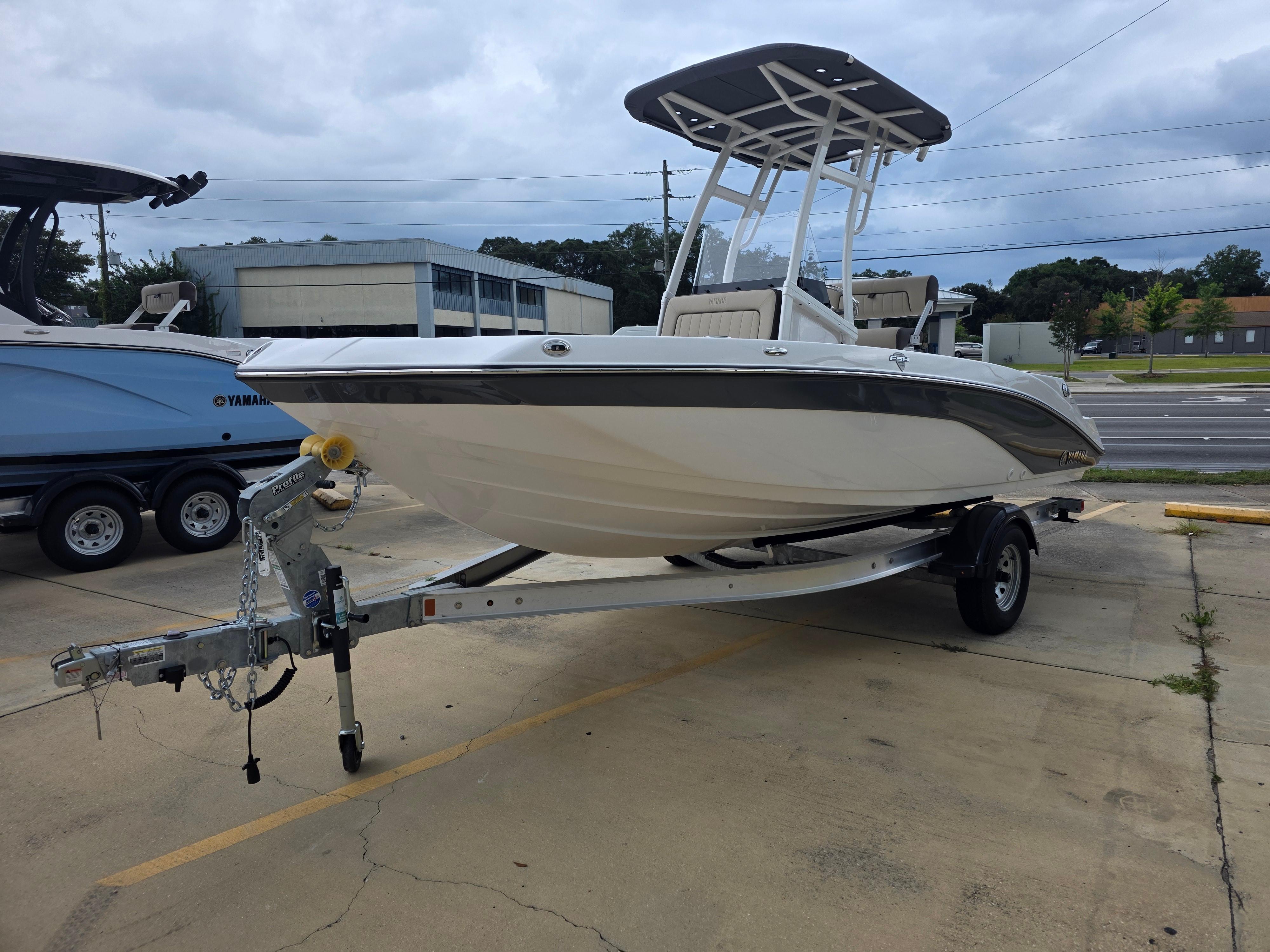 Yamaha Boats 195 FSH Sport 2025 Yamaha Boats 195 FSH Sport on trailer, parked outdoors, overcast sky.
