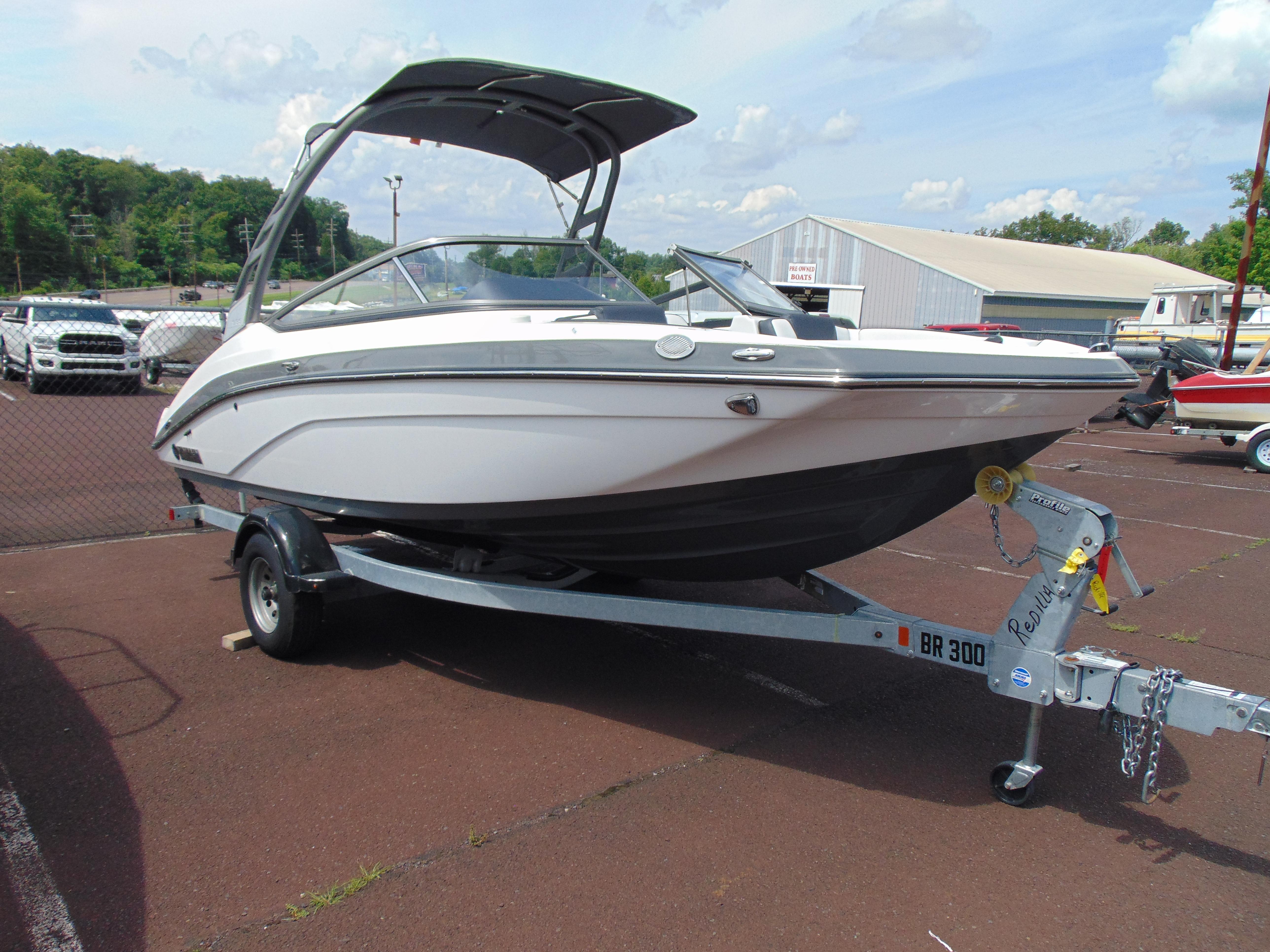 Yamaha Boats 195S 2020 Yamaha Boats 195S on trailer in parking lot, sunny day.