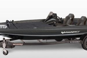 Phoenix 920 Elite 2026 Phoenix 920 Elite boat, sleek design, black finish, dual seating, on trailer.